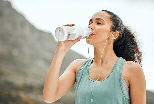 Woman drinking from a water bottle