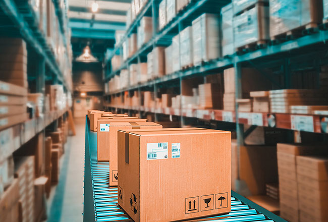 Big cardboard boxes on a conveyor belt