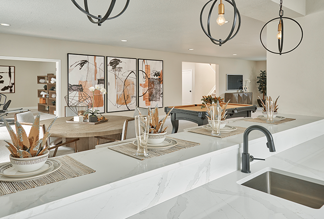 Basement wet bar with white countertops