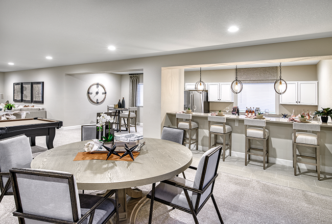 Rec room with table and wet bar