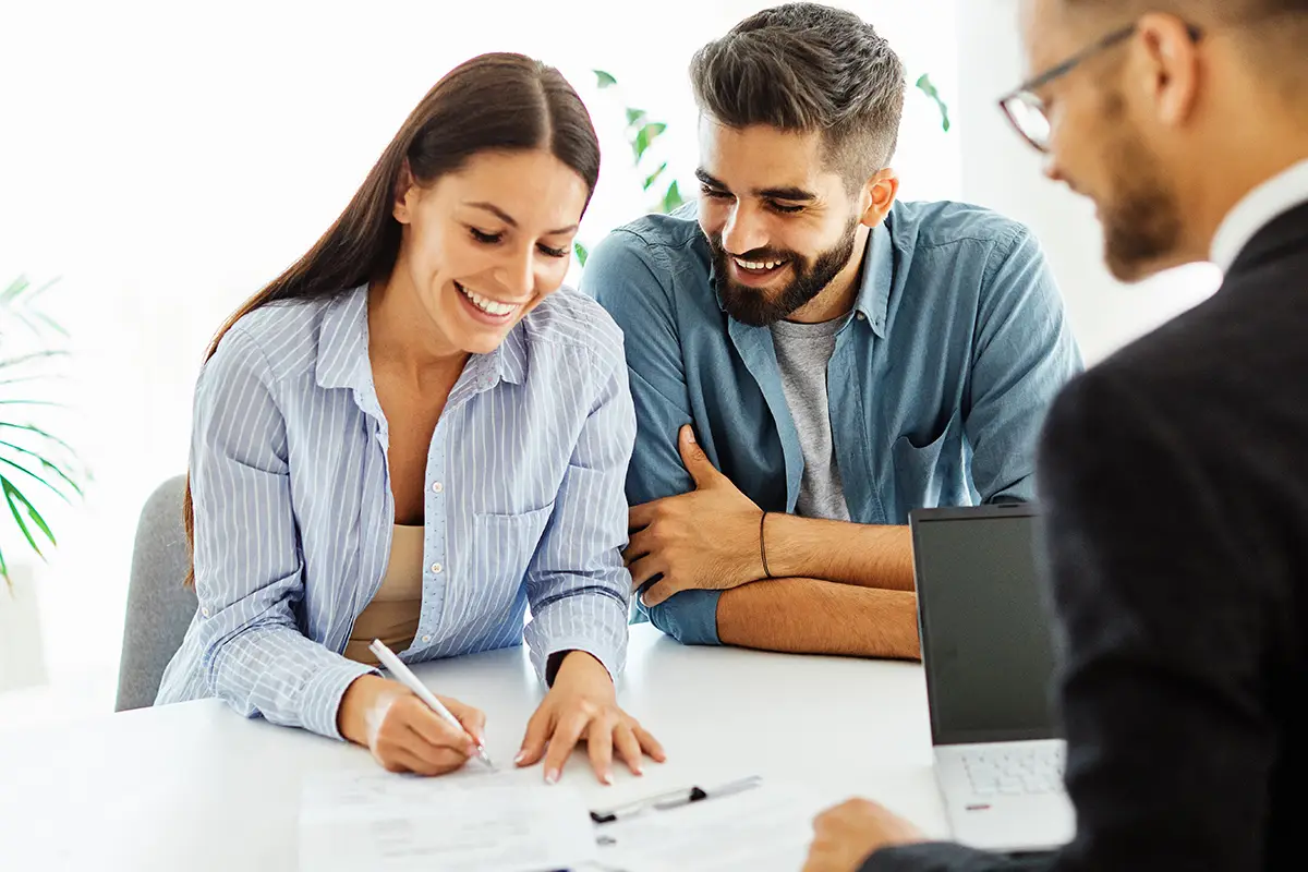 Man and woman sitting at table discussing finance