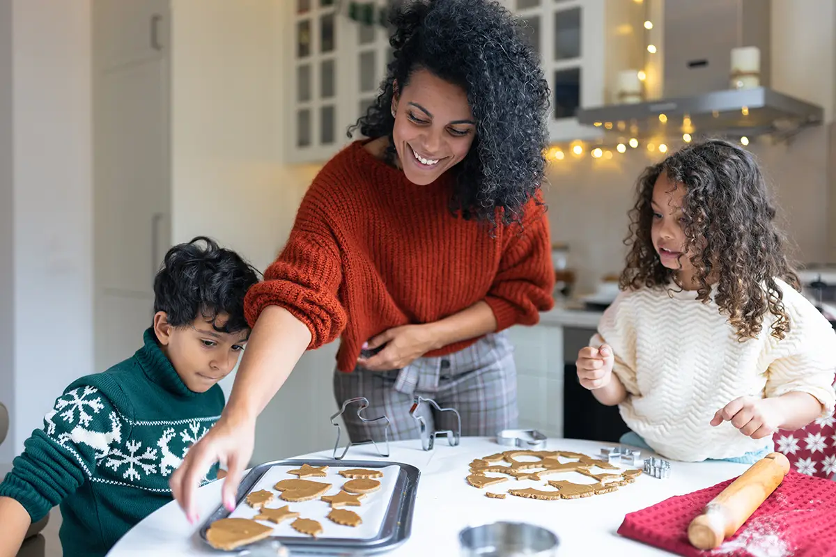 Mom baking cookies with daughter and son.
