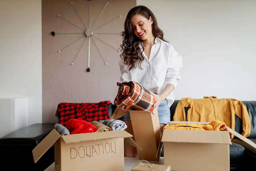 Woman packing boxes