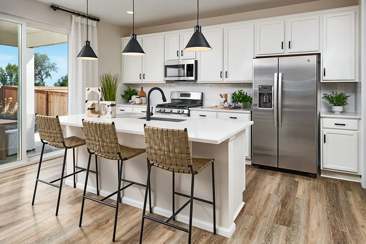 Kitchen with white cabinets and a center island