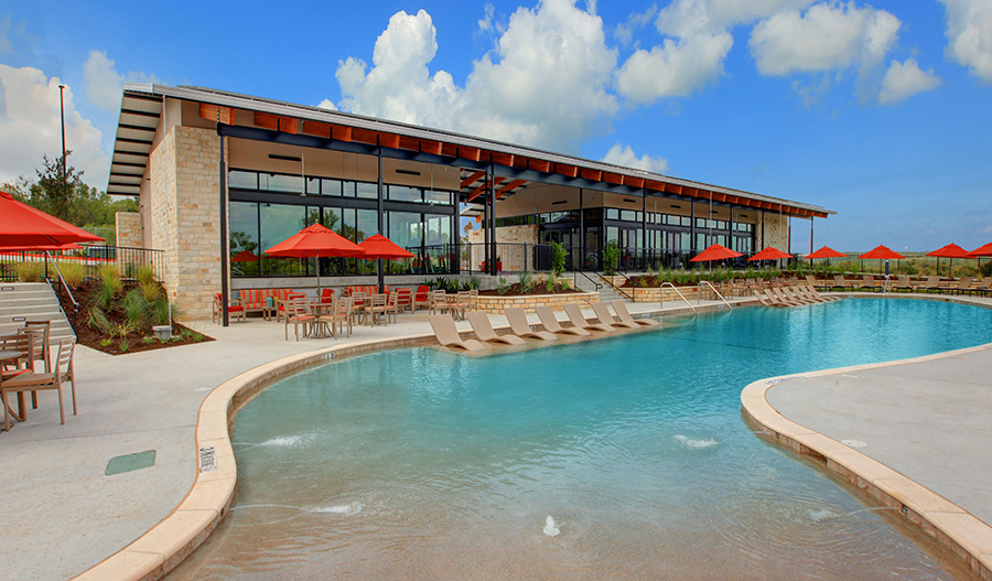 Community pool and clubhouse at Whisper Valley