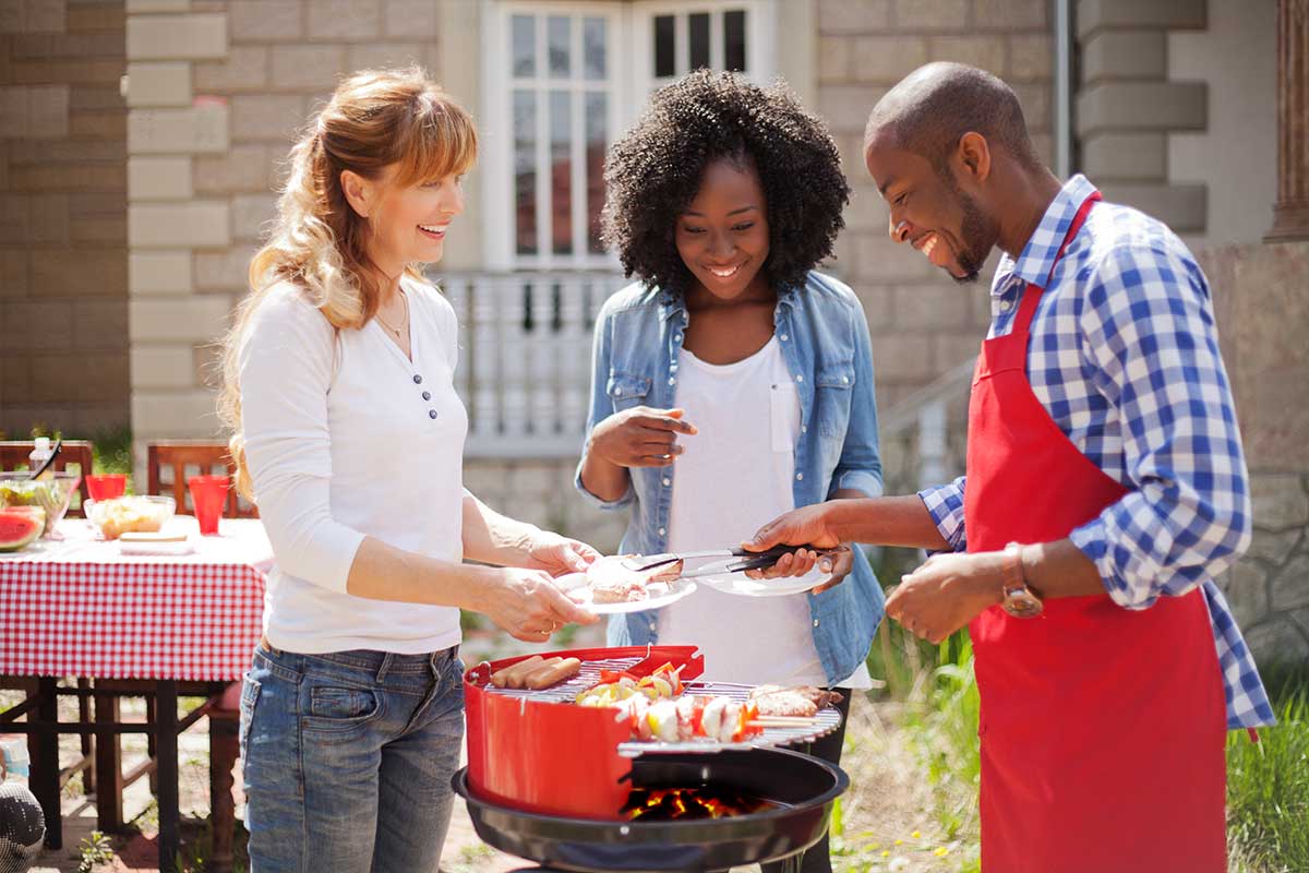 neighbors enjoying a bbq on a sunny day