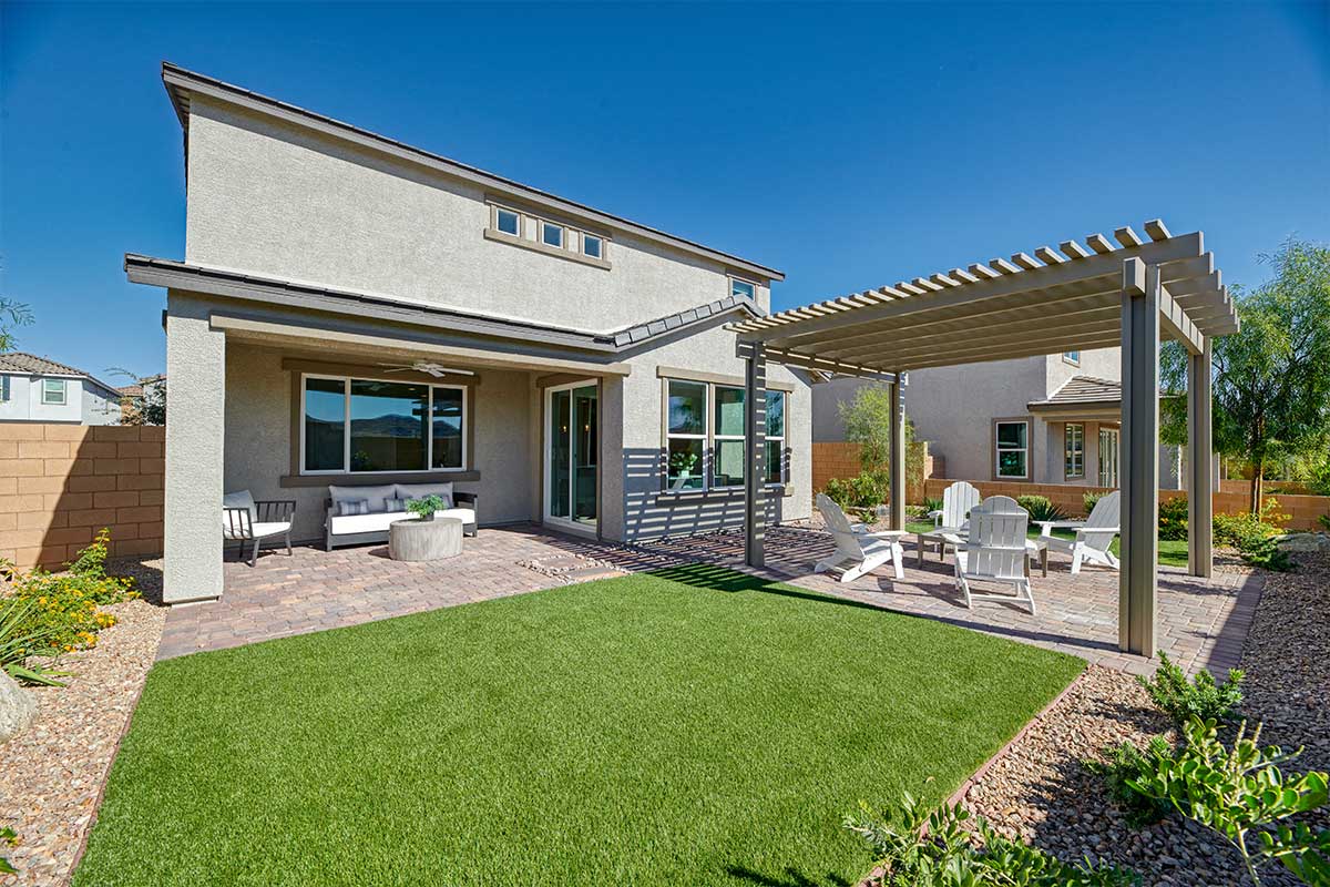 impressive backyard with a pergola and covered patio