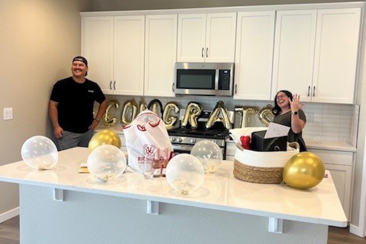 Couple Celebrates New Home… and an Engagement!