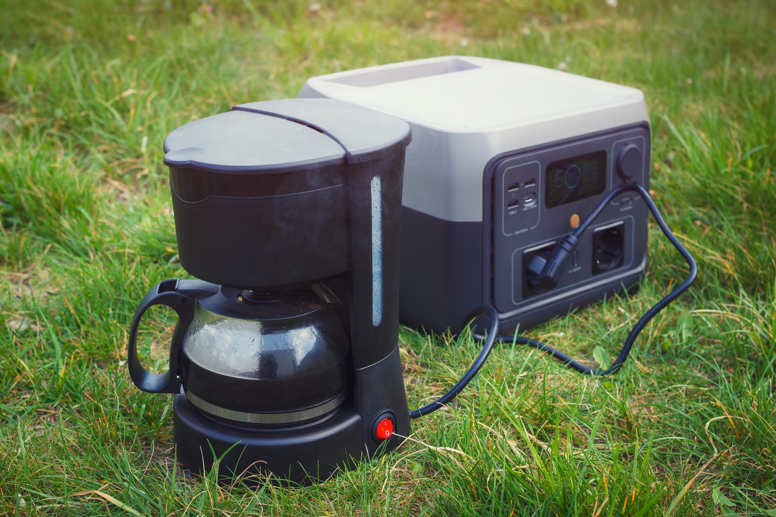 Coffee maker plugged into a portable charging station