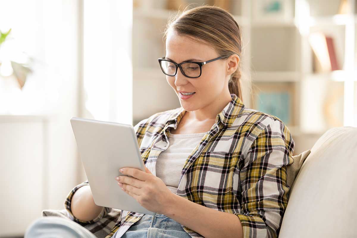 Woman reading a tablet