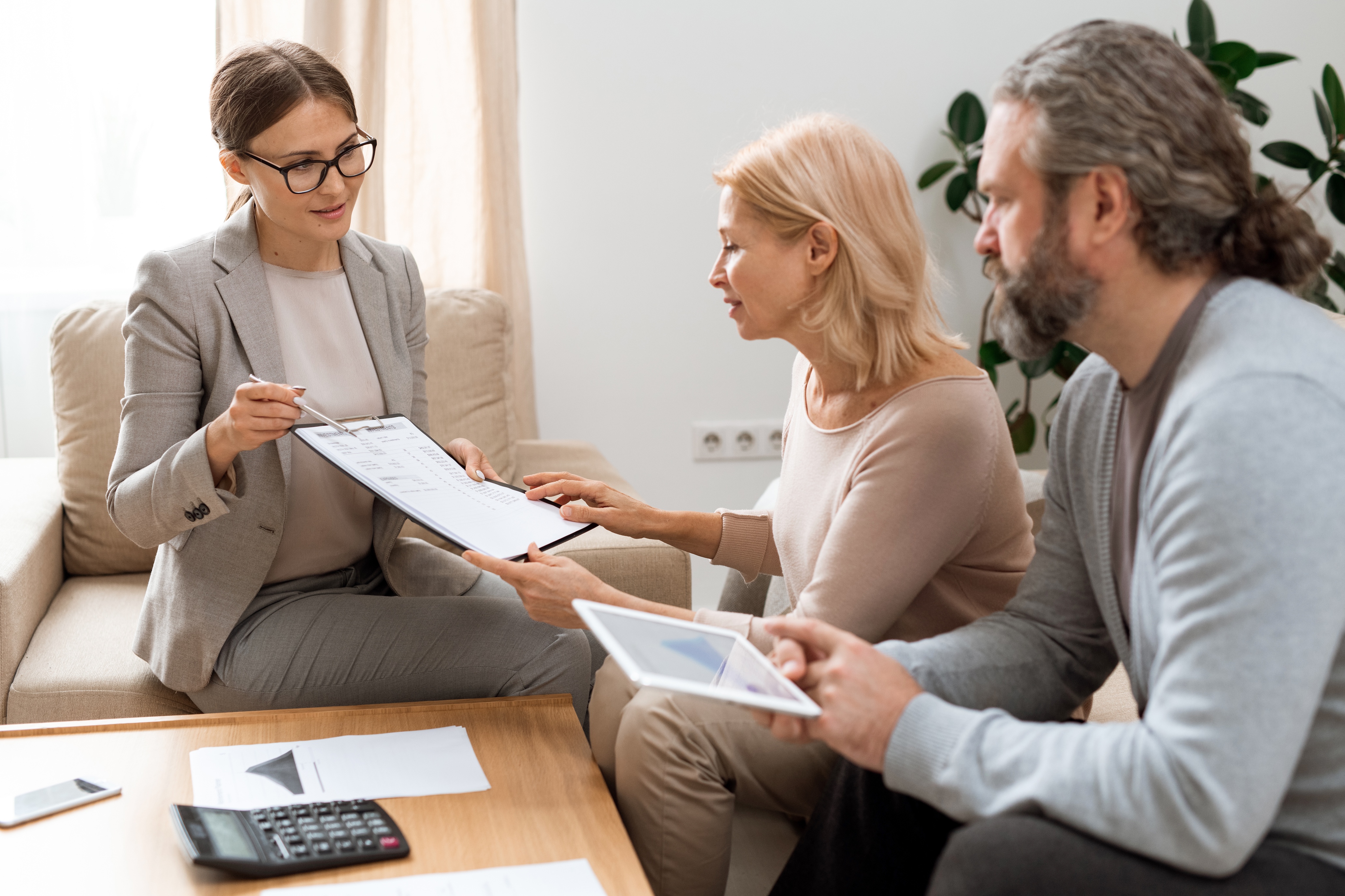 Real estate agent explaining a contract to her clients