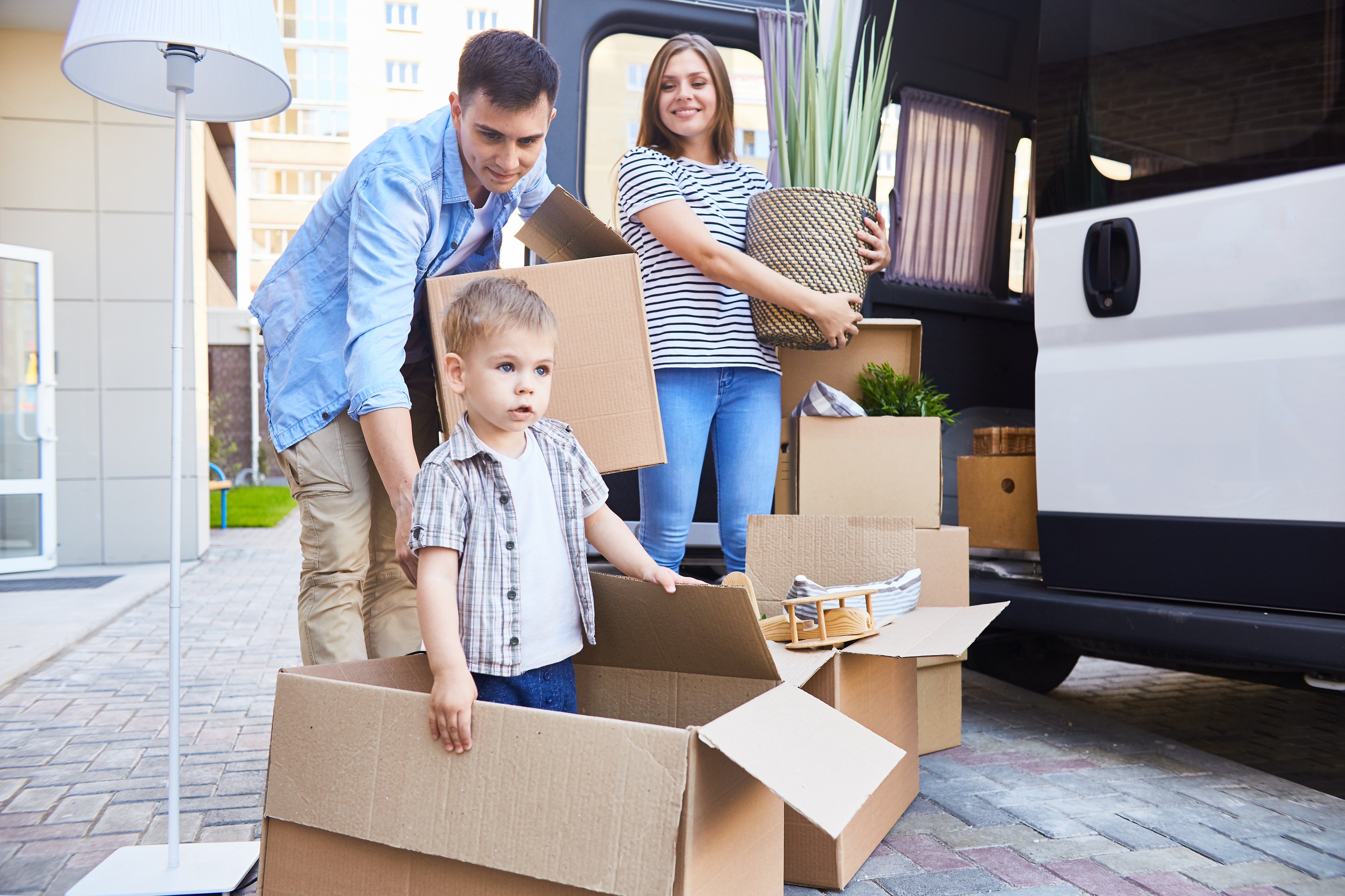 Family packing boxes for a move