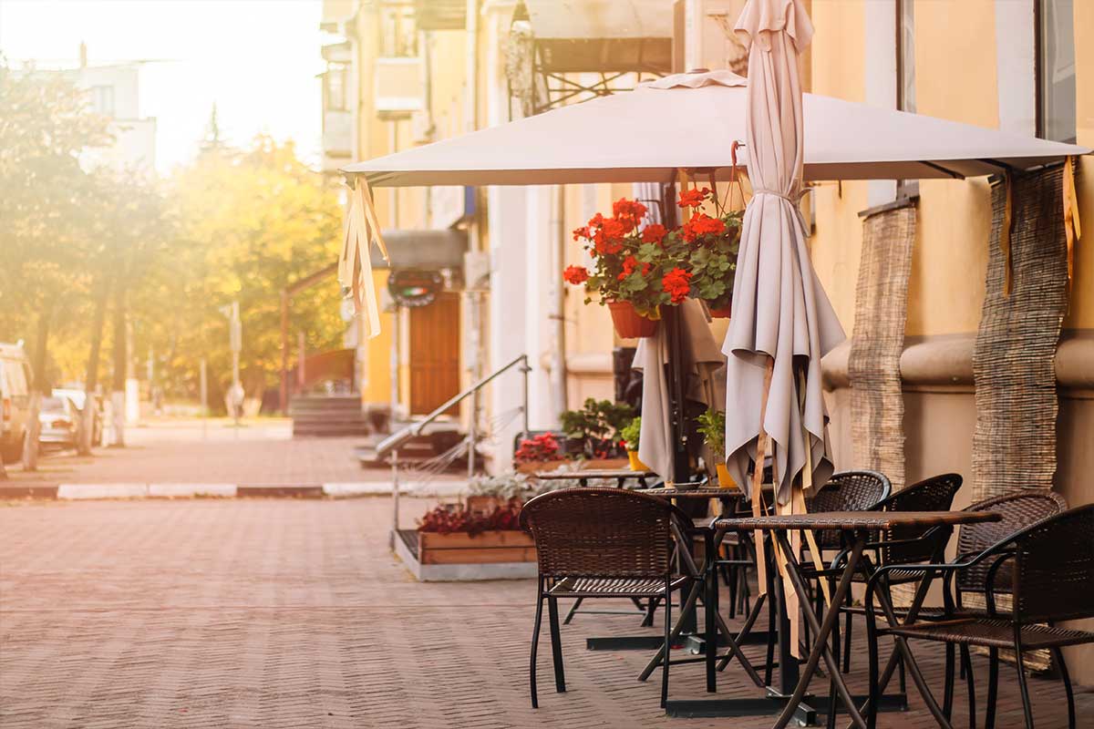 Empty tables on a restaurant's patio