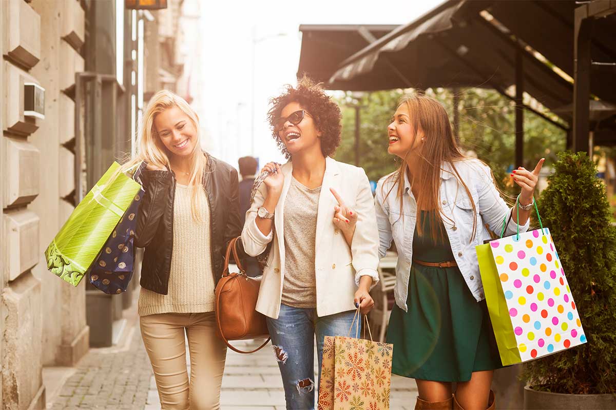 Group of women at an outdoor shopping plaza