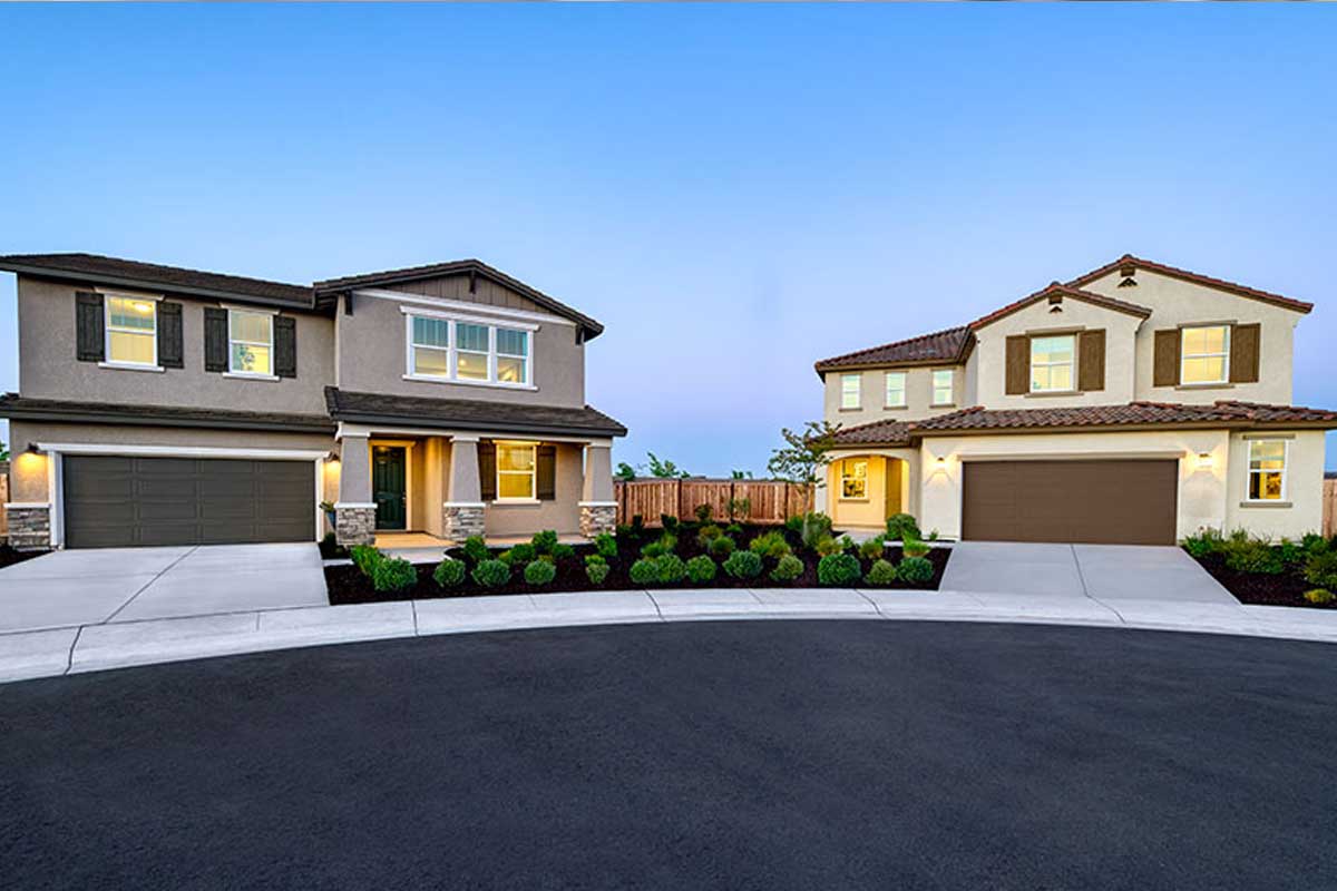 Streetscape featuring two inspired home exteriors 