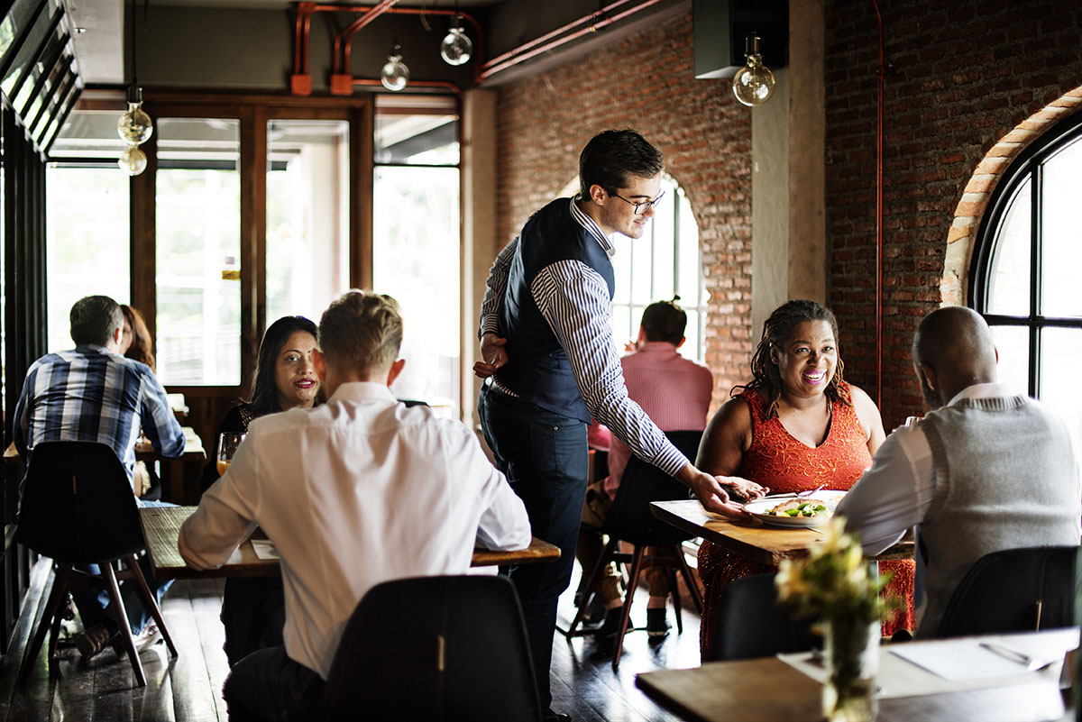Waiter waiting on people at a restaurant