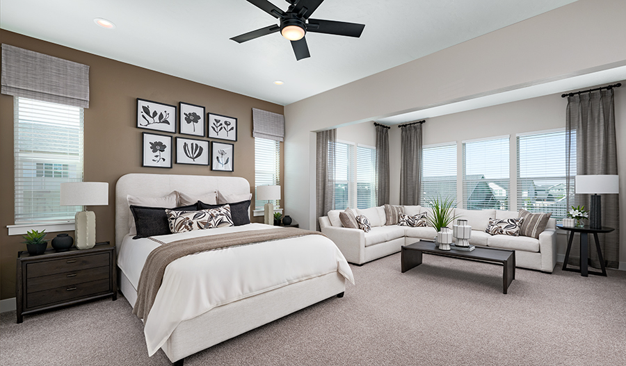 A lavish primary suite with a private sitting area