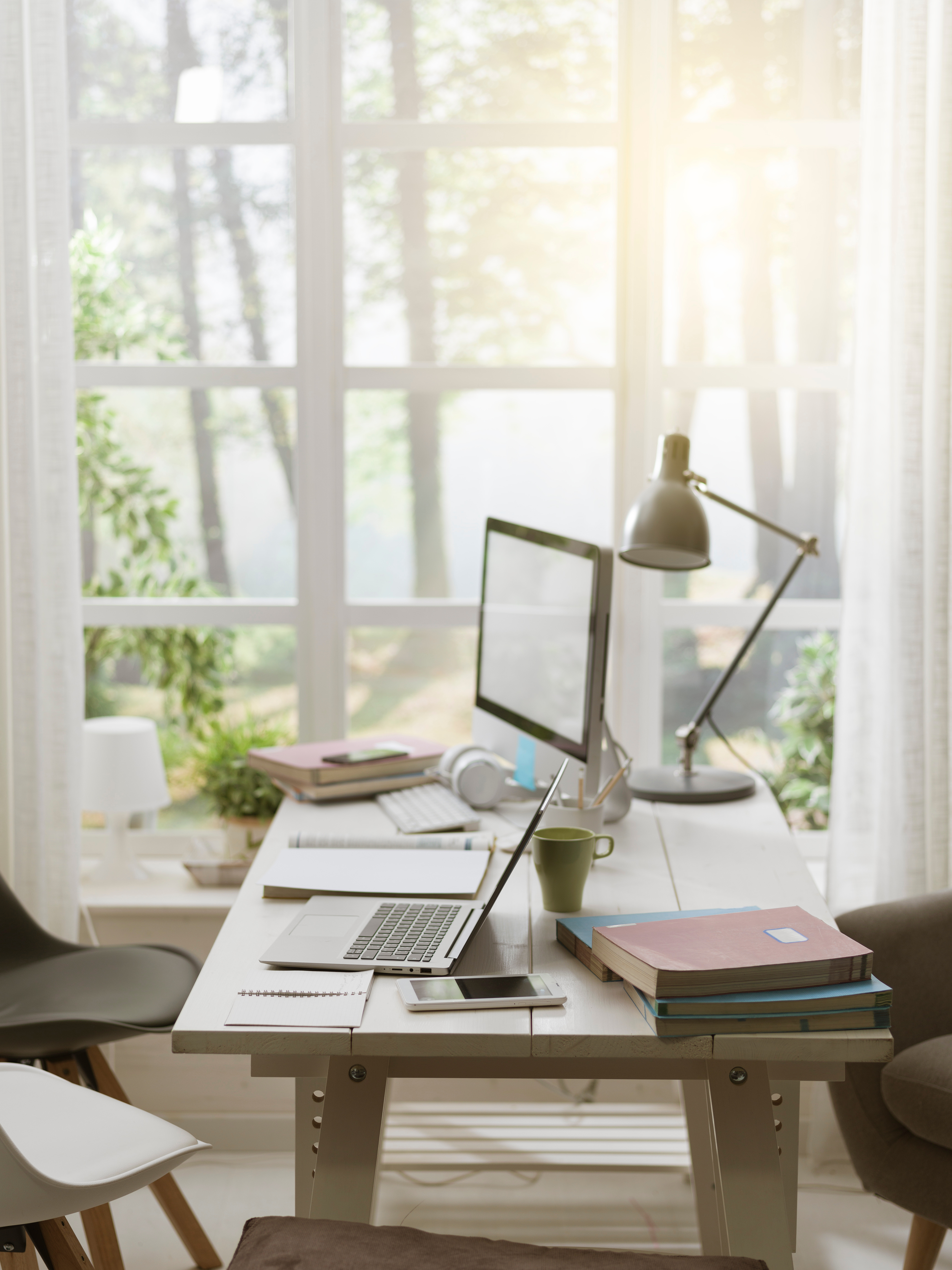 Natural light shining through windows in a home office
