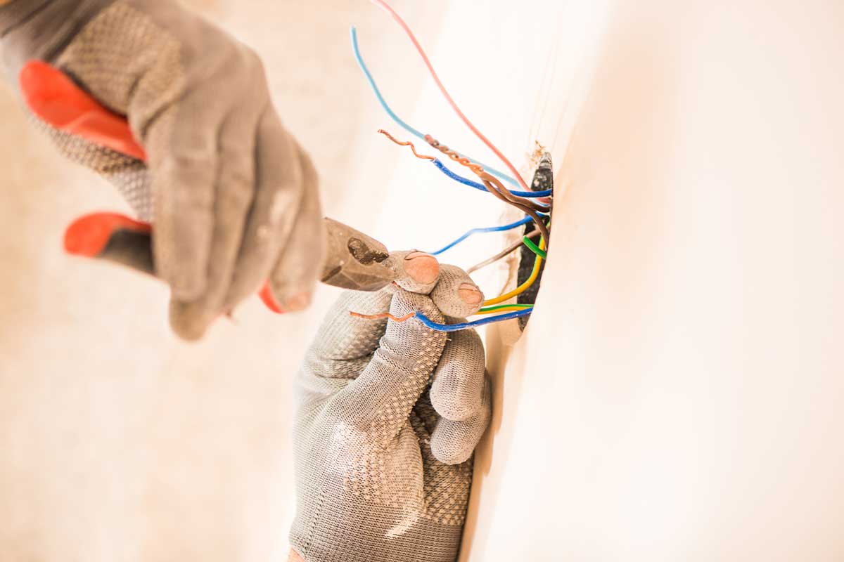 Loose wires being tended to by a handyman