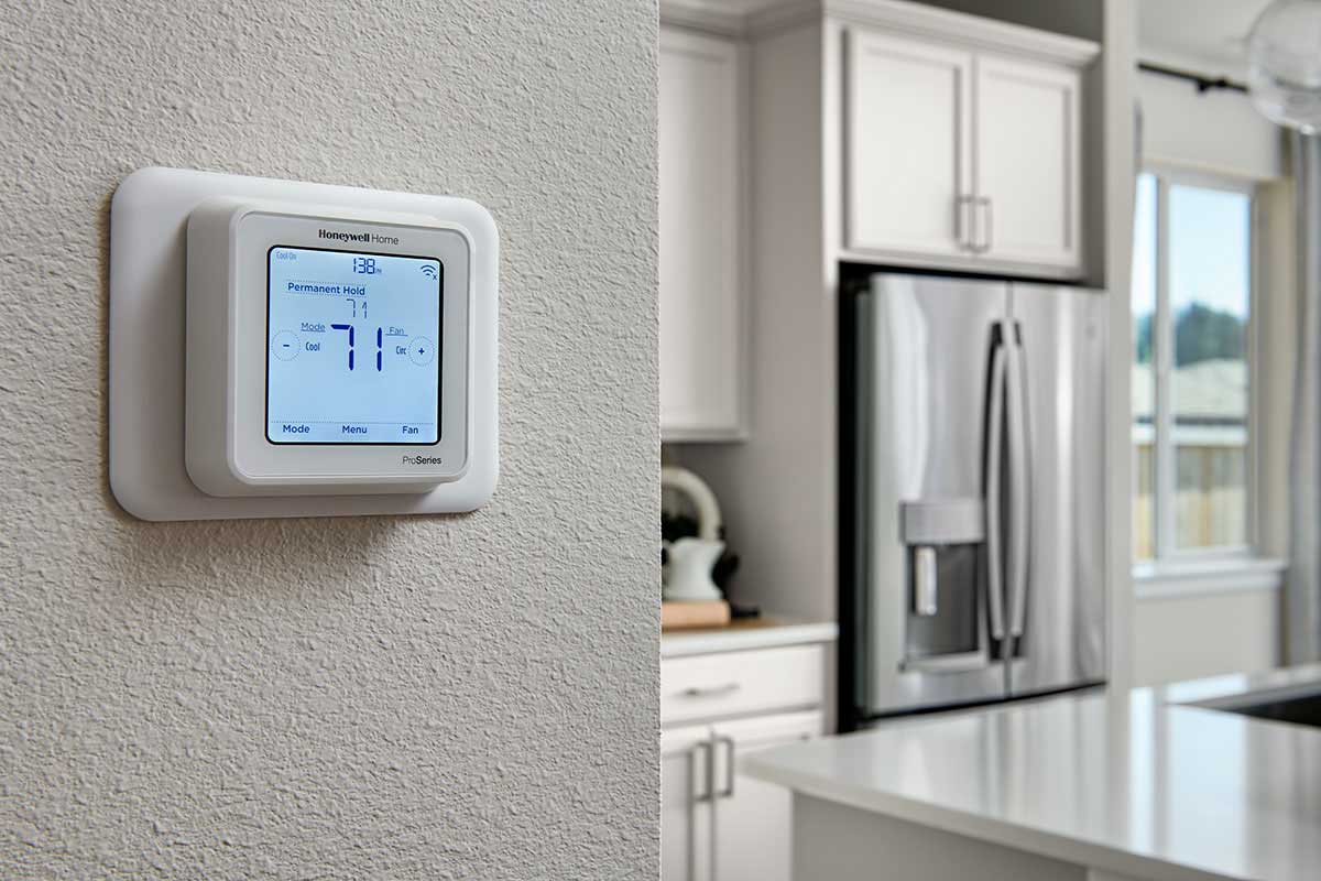 A thermostat on a white wall
