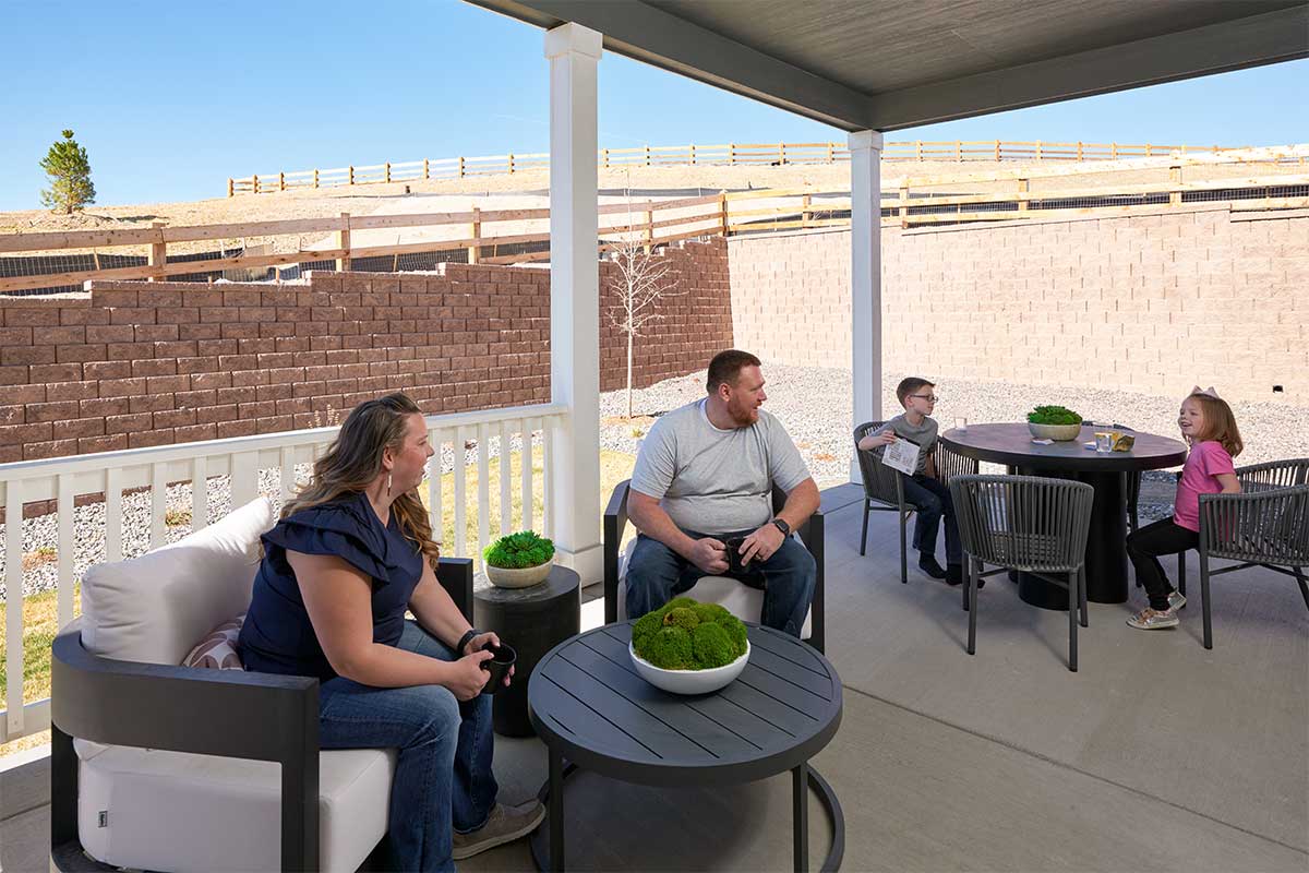 Young family enjoying a covered patio