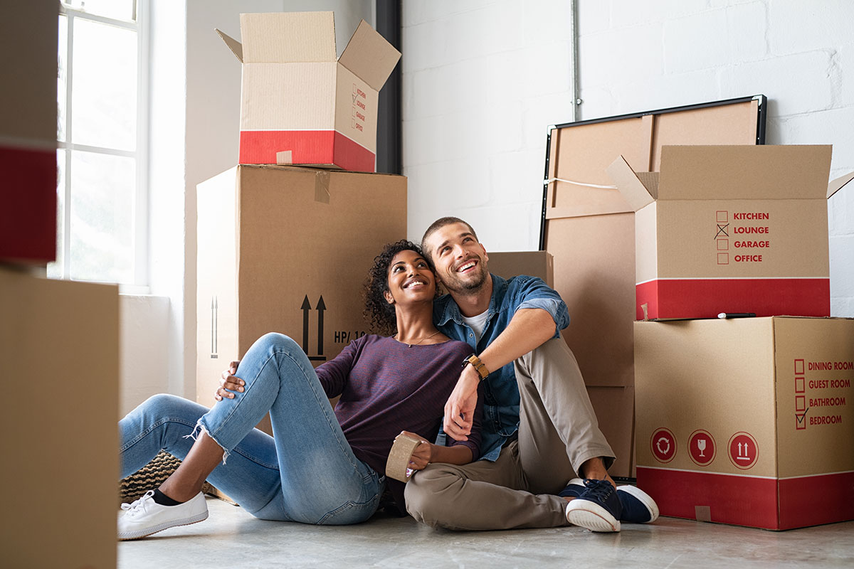 Content couple taking a break from moving