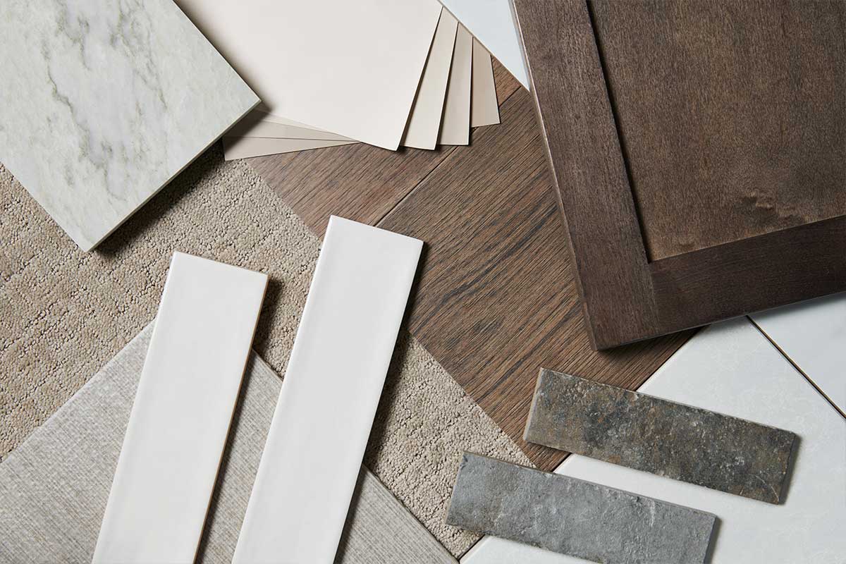 swatches of kitchen countertop materials with cabinet options