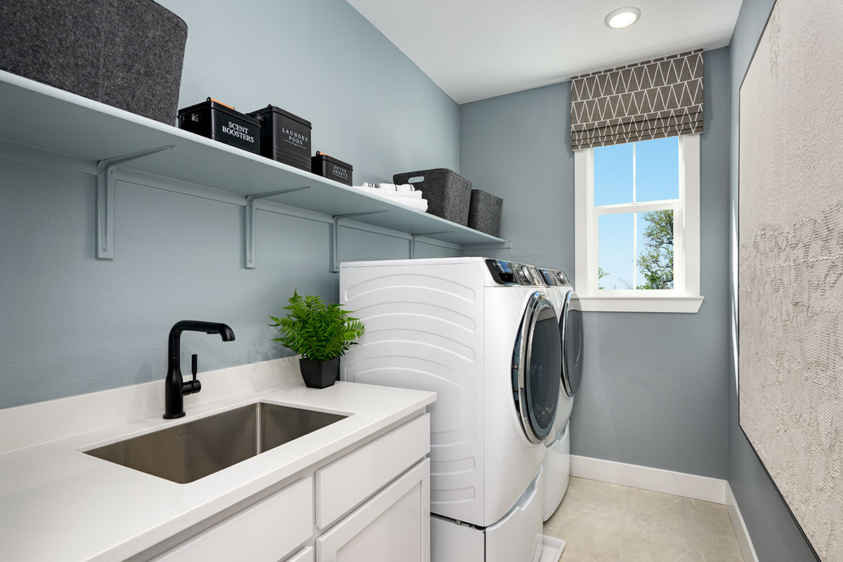 modern laundry room with built-in cabinets for home storage