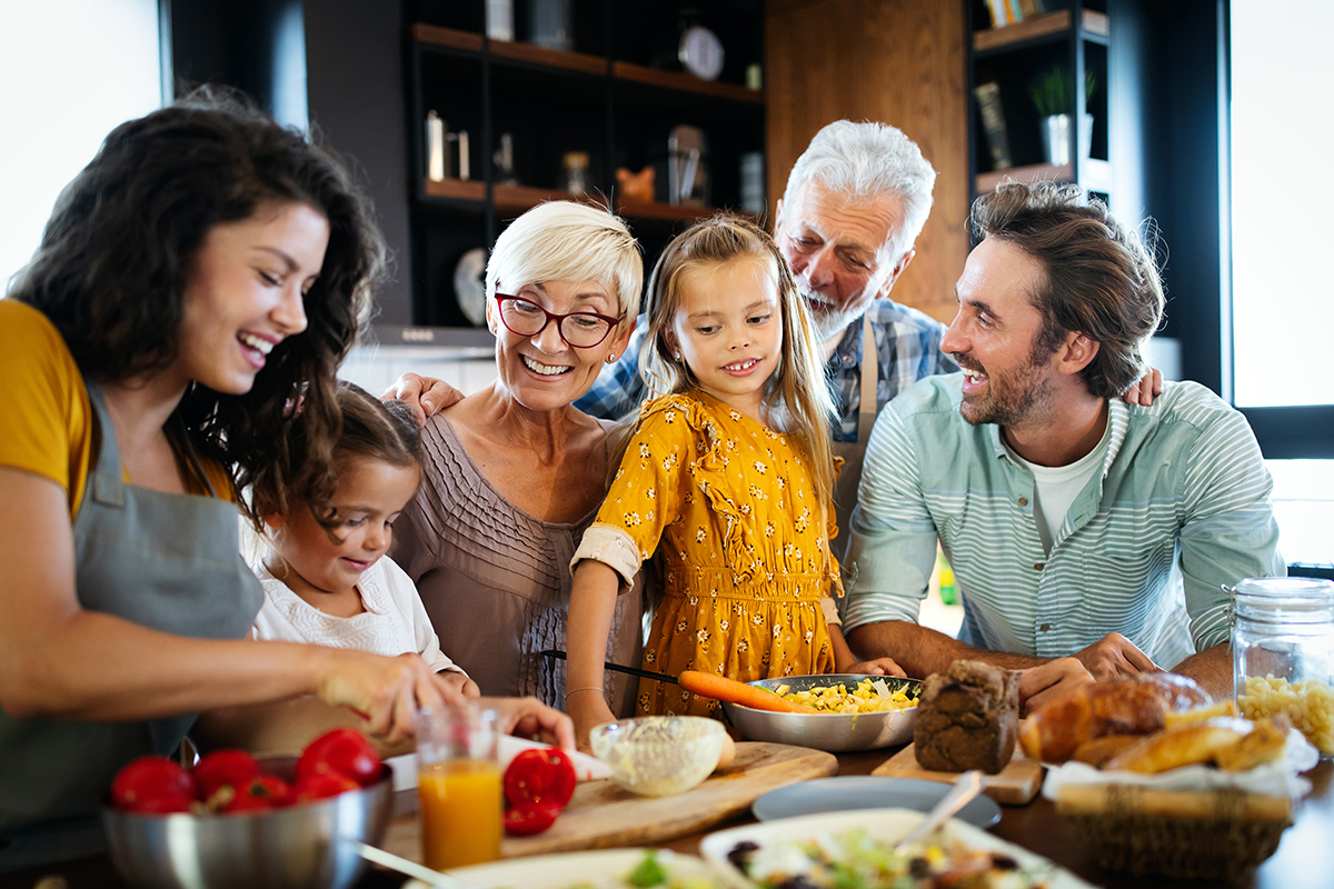 happy multigenerational family gathered around a dinner table