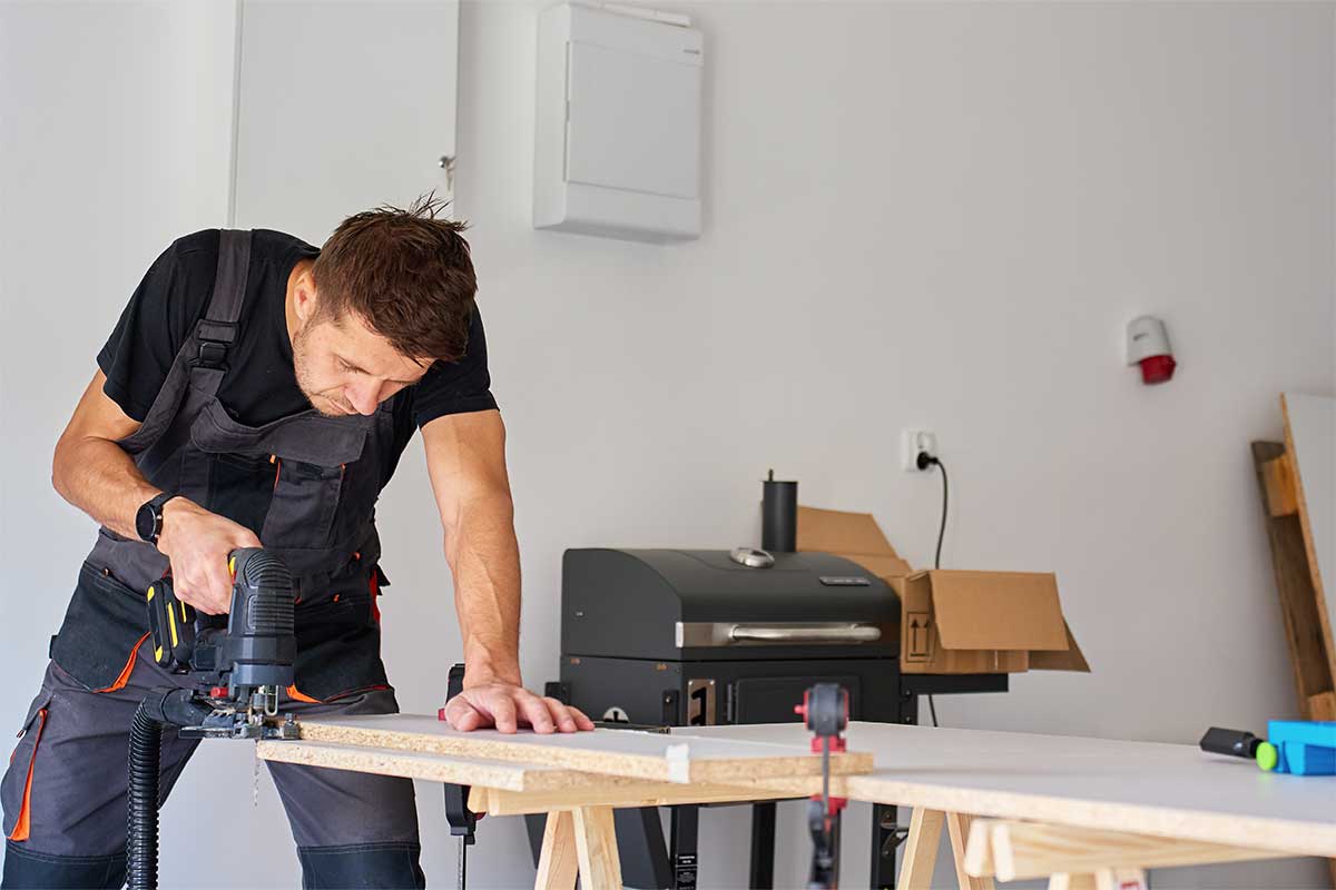 man using a table saw