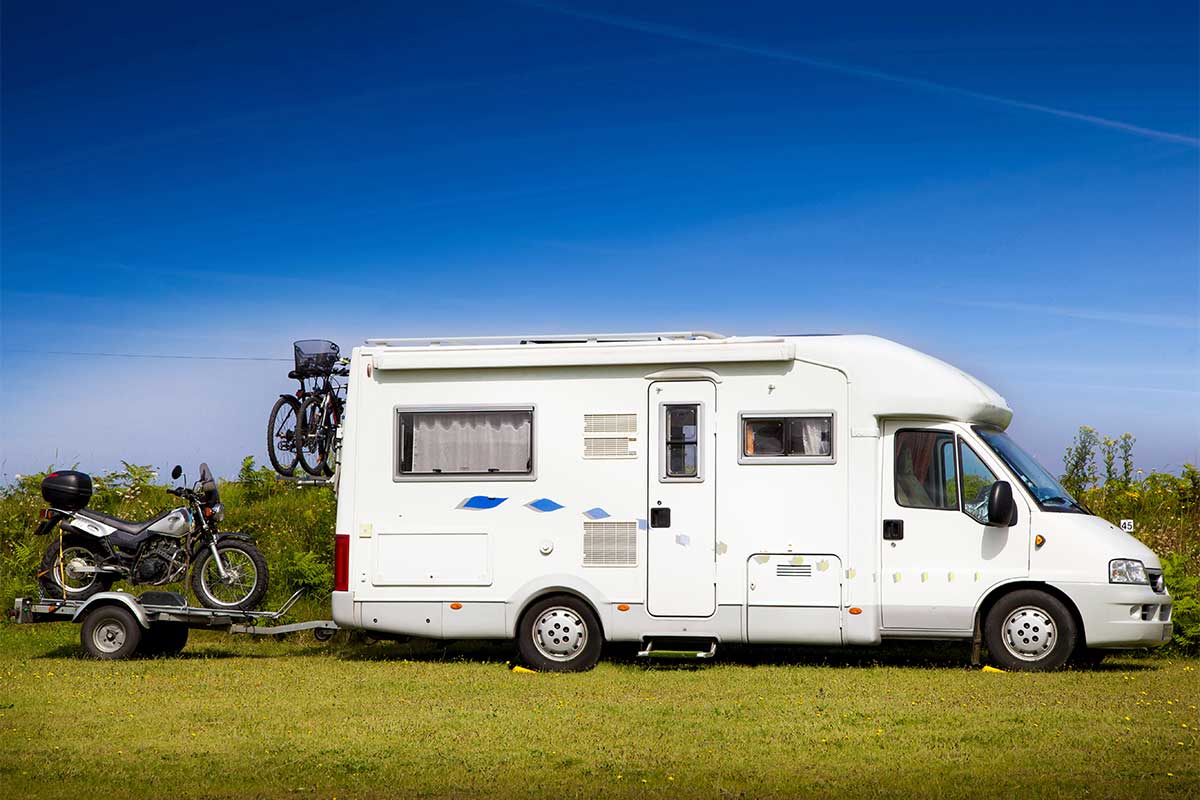 an RV towing a bike
