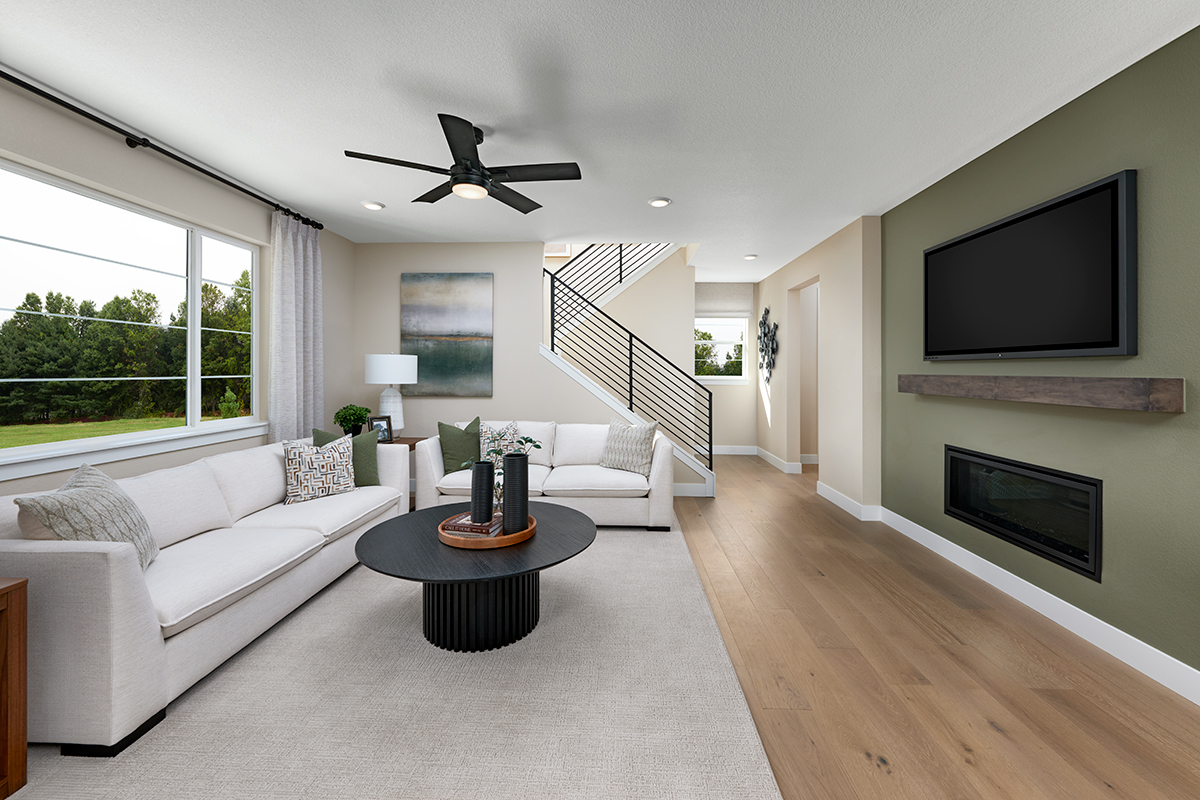 An electric fireplace and television setup in a great room
