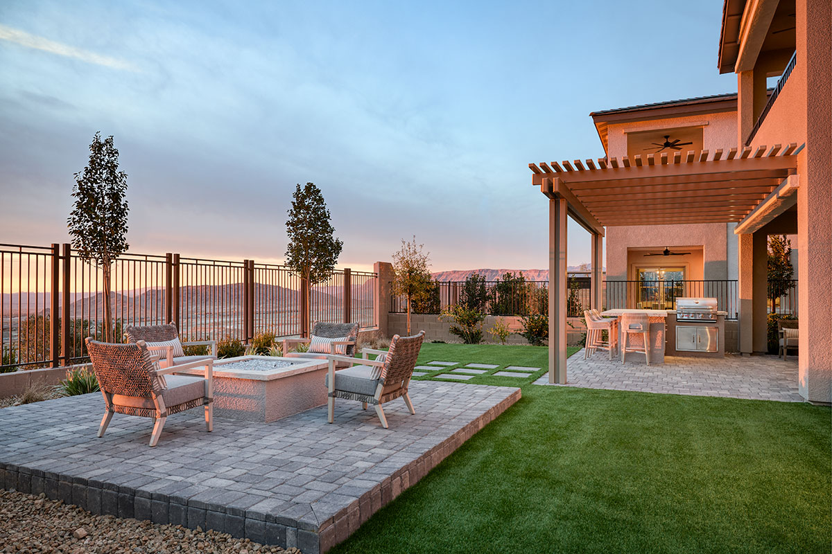Relaxing outdoor living space with covered patio and firepit area.