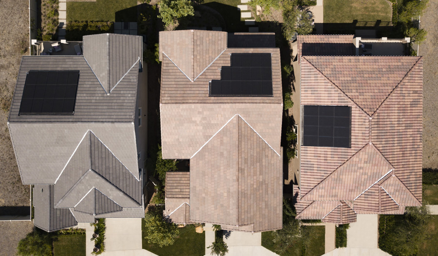 overhead photo of solar panels on homes