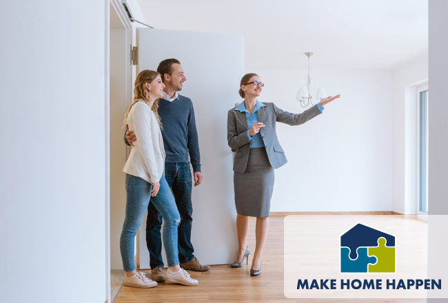 Real estate agent showing home to couple