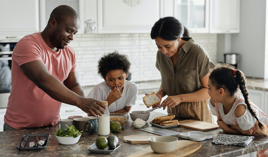 Family helping make dinner in the kitchen
