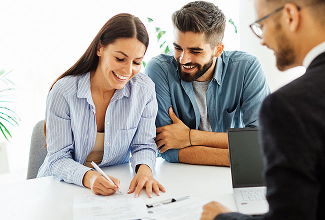 Couple signing a contract