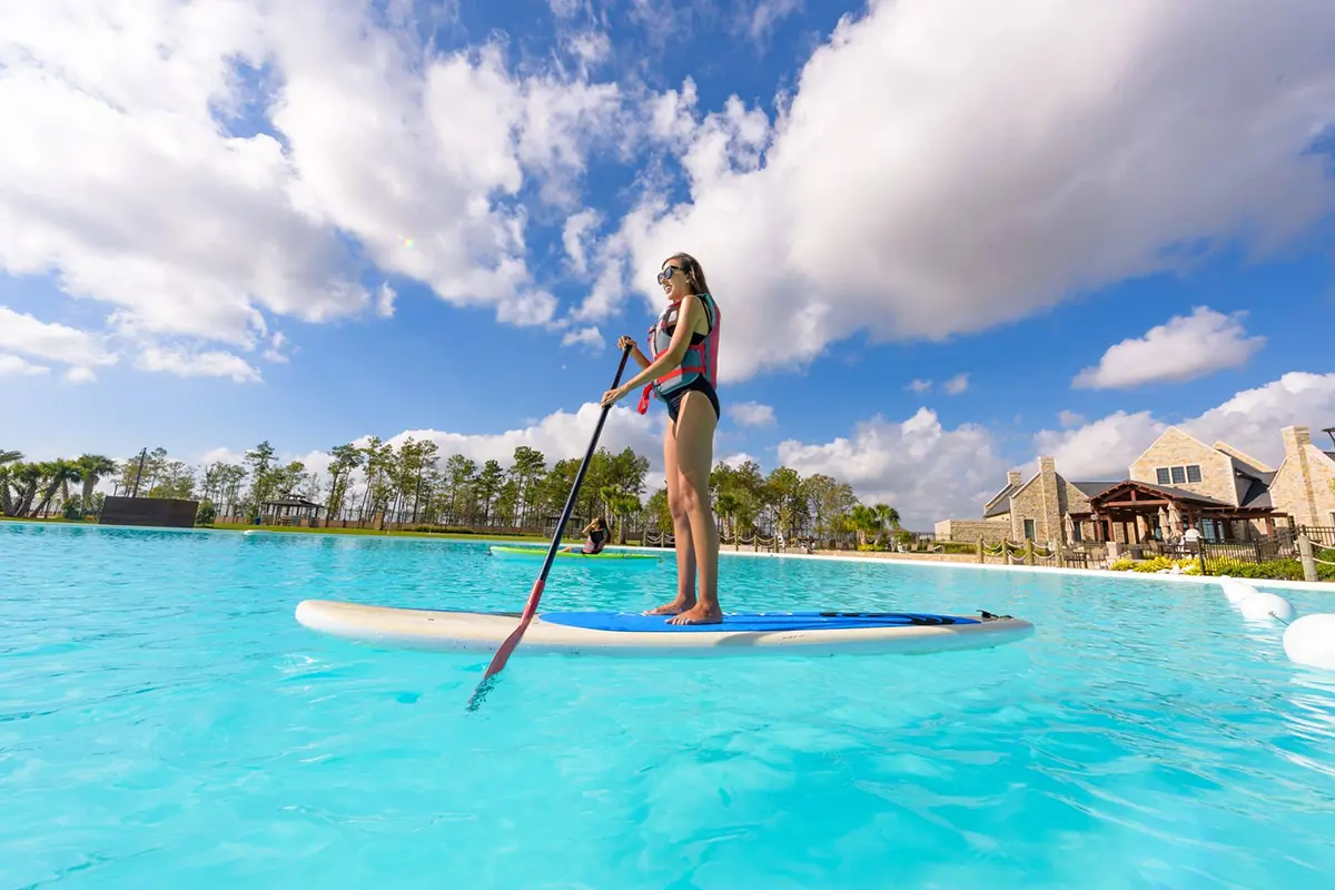 Girl standing on paddleboard