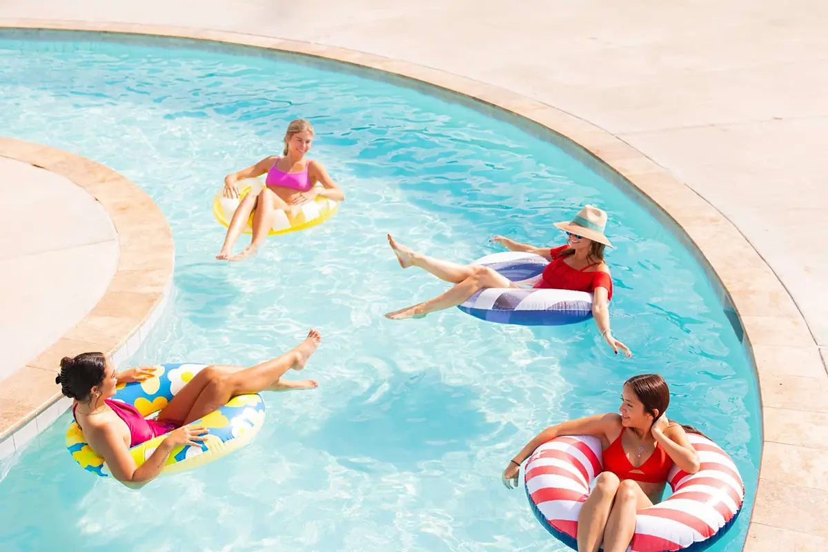 People floating down a lazy river on tubes