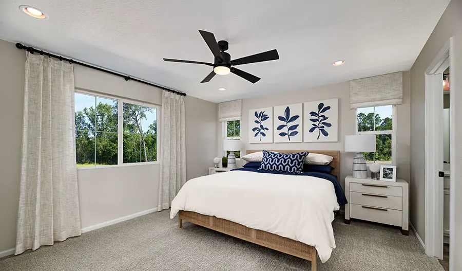 Primary bedroom with blue accent décor 