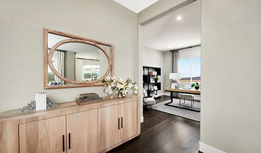 Decorative mirror and cabinets in the hallway outside a study