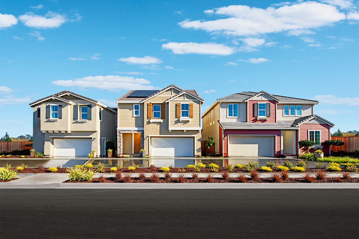 Three homes on a street, all with two-car garages and the middle one with solar panels