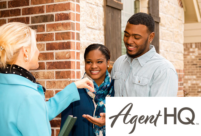 Couple standing outside of new home smiling and getting keys from real estate agent