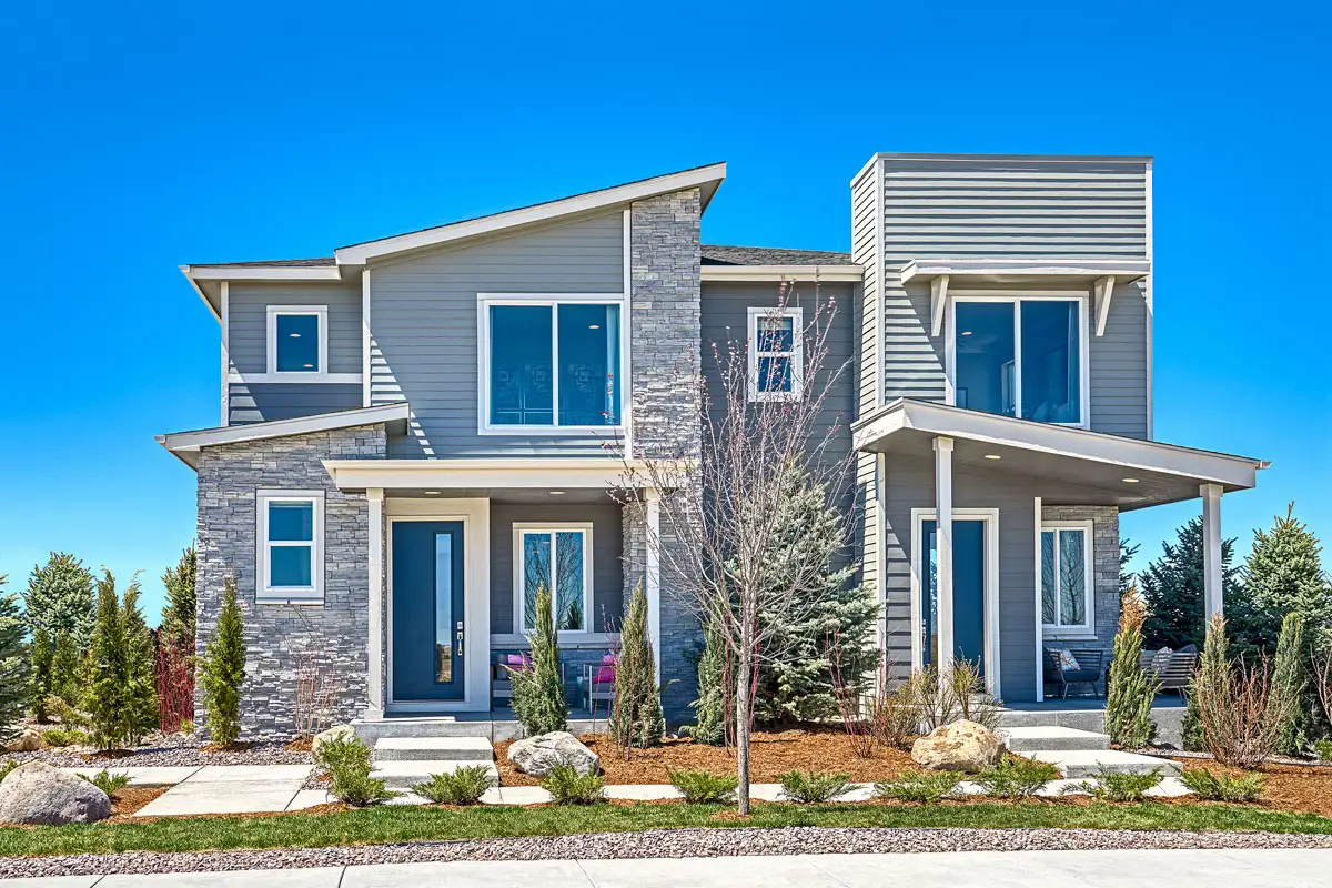 Urban collection duplex with stone accents and large second floor windows