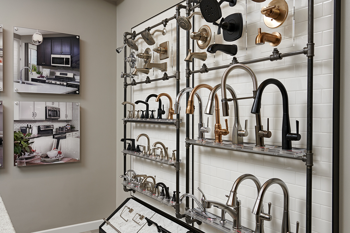 Wall showcasing a veriety of faucet options